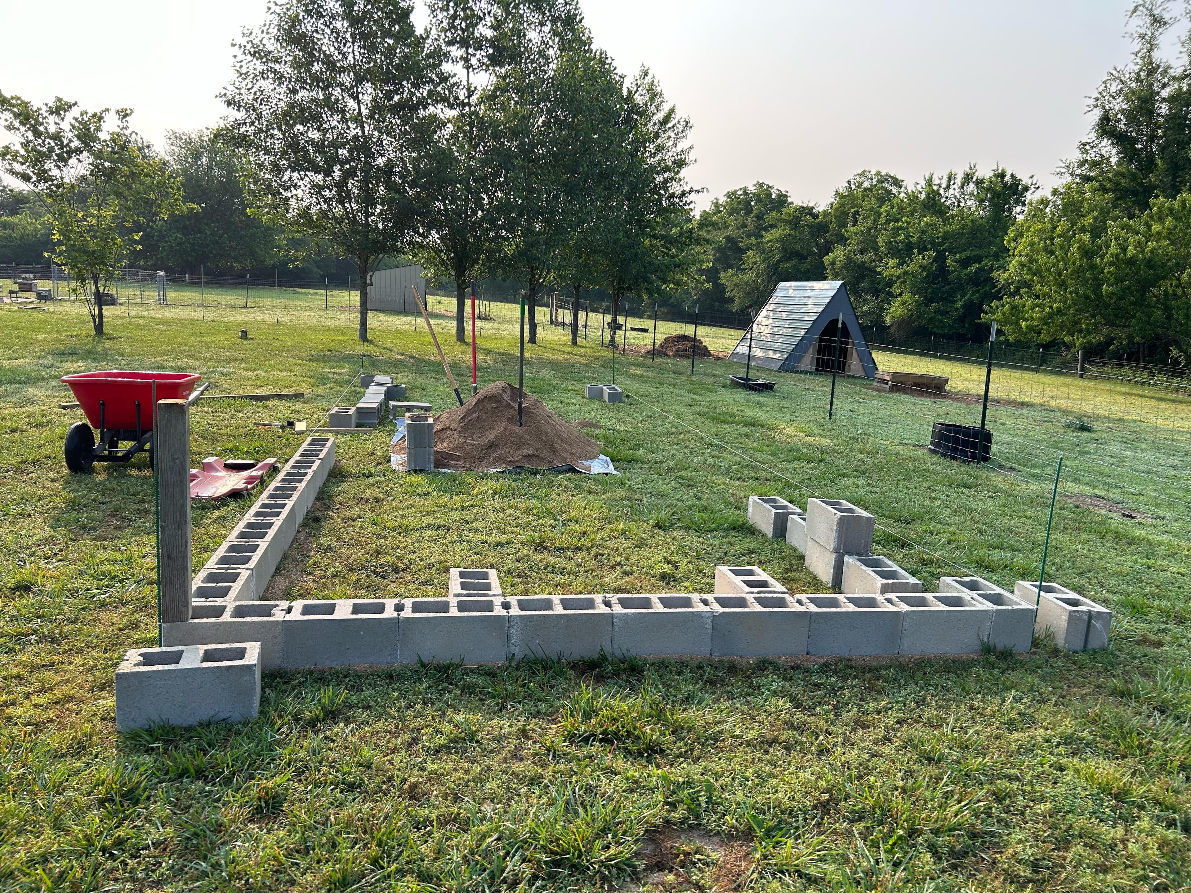 Patio hardscape installation with surrounding landscaping